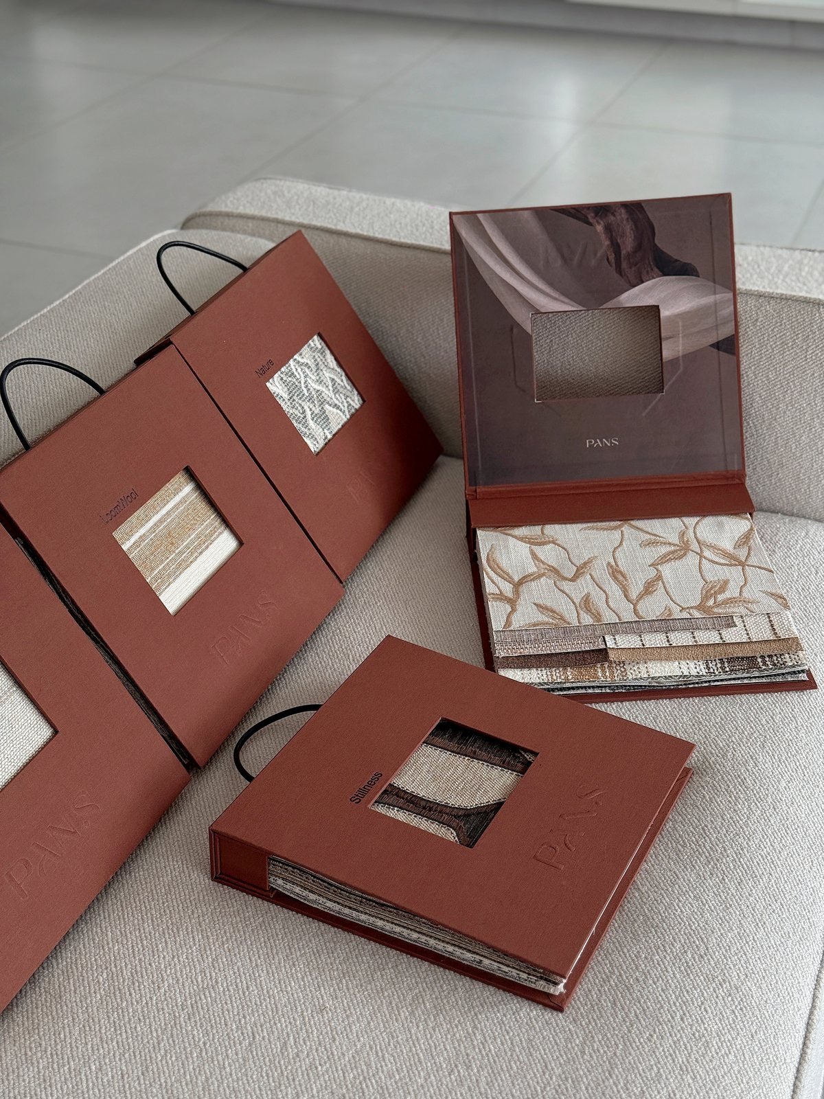 Ksino rust sample books opened with fabric cards