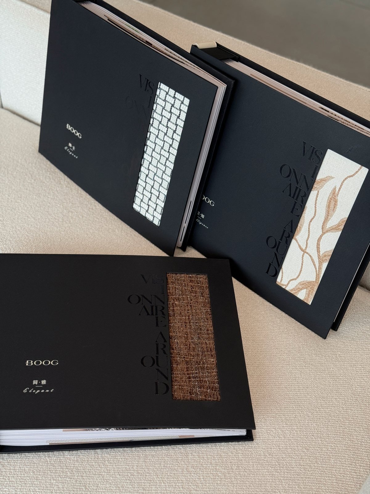 Ksino black sample books showing sheer and dimout fabrics
