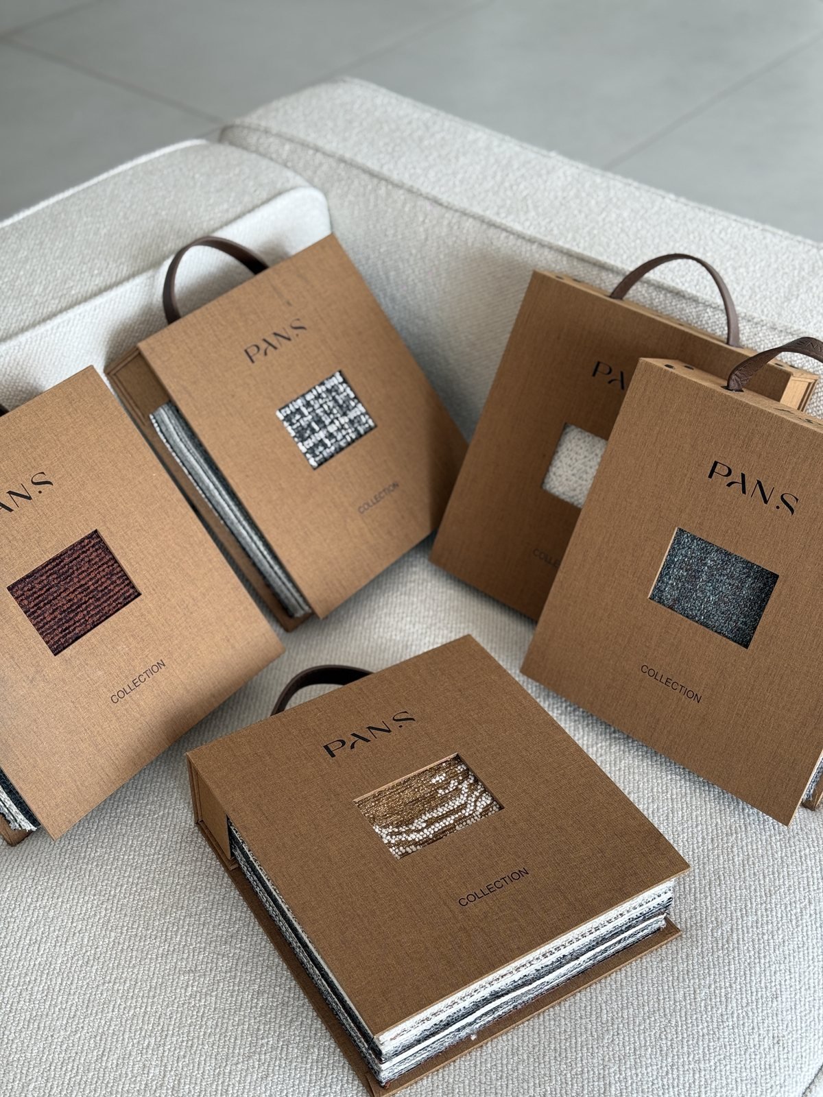 Ksino upholstery fabric books with visible swatches