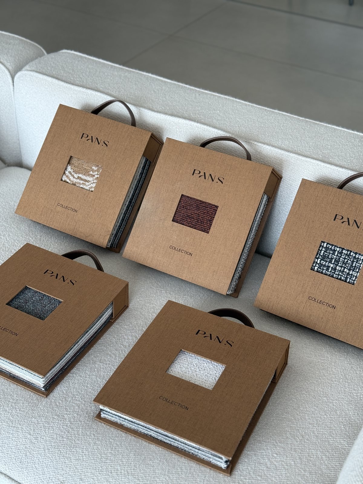 Ksino upholstery sample books in warm kraft covers
